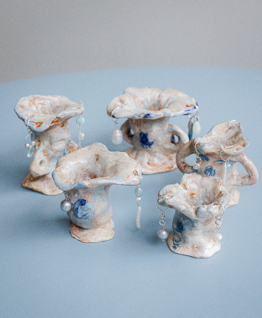 Multi-coloured candle holders with precious stones