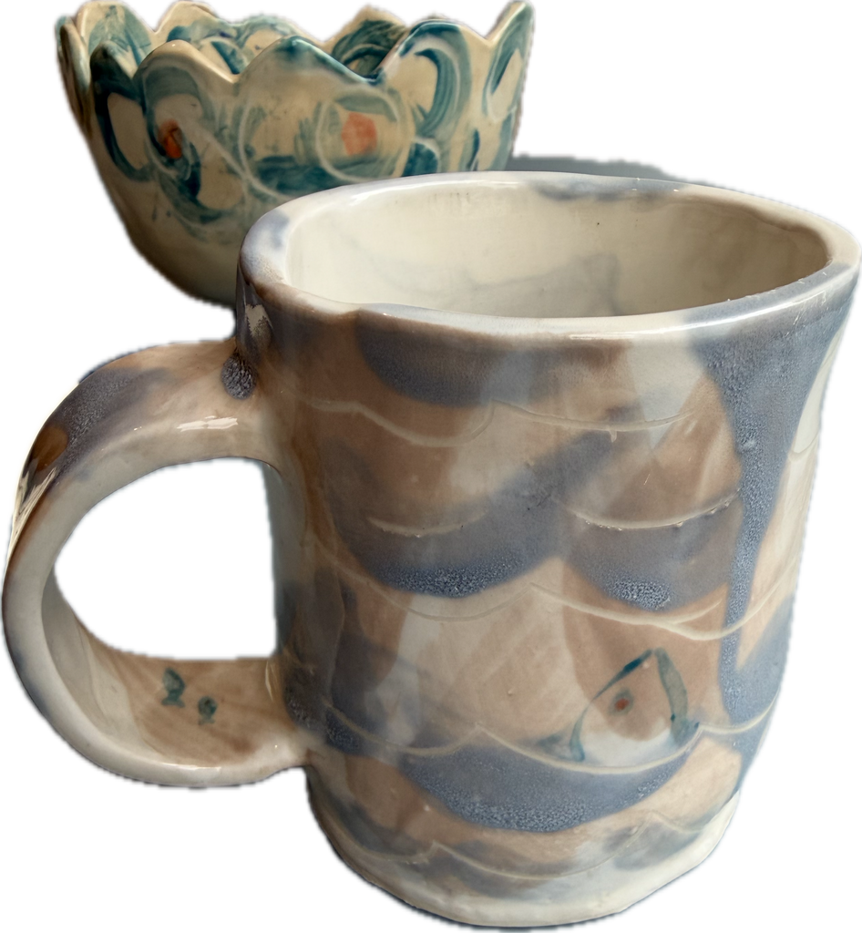 Light blue fish in water mug