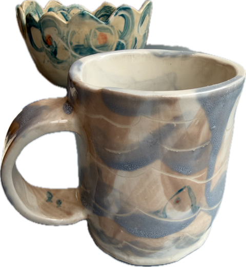 Light blue fish in water mug