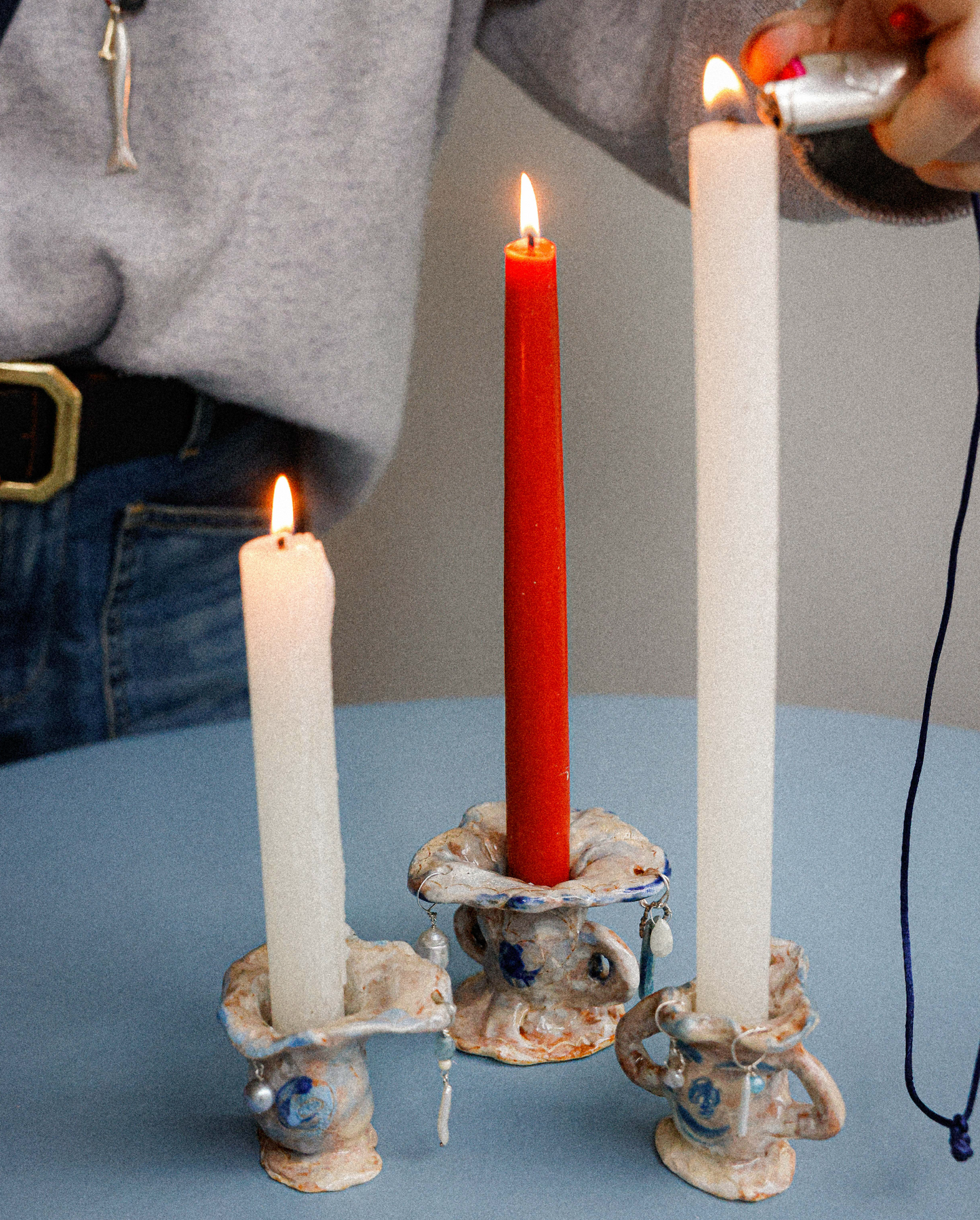 Multi-coloured candle holders with precious stones